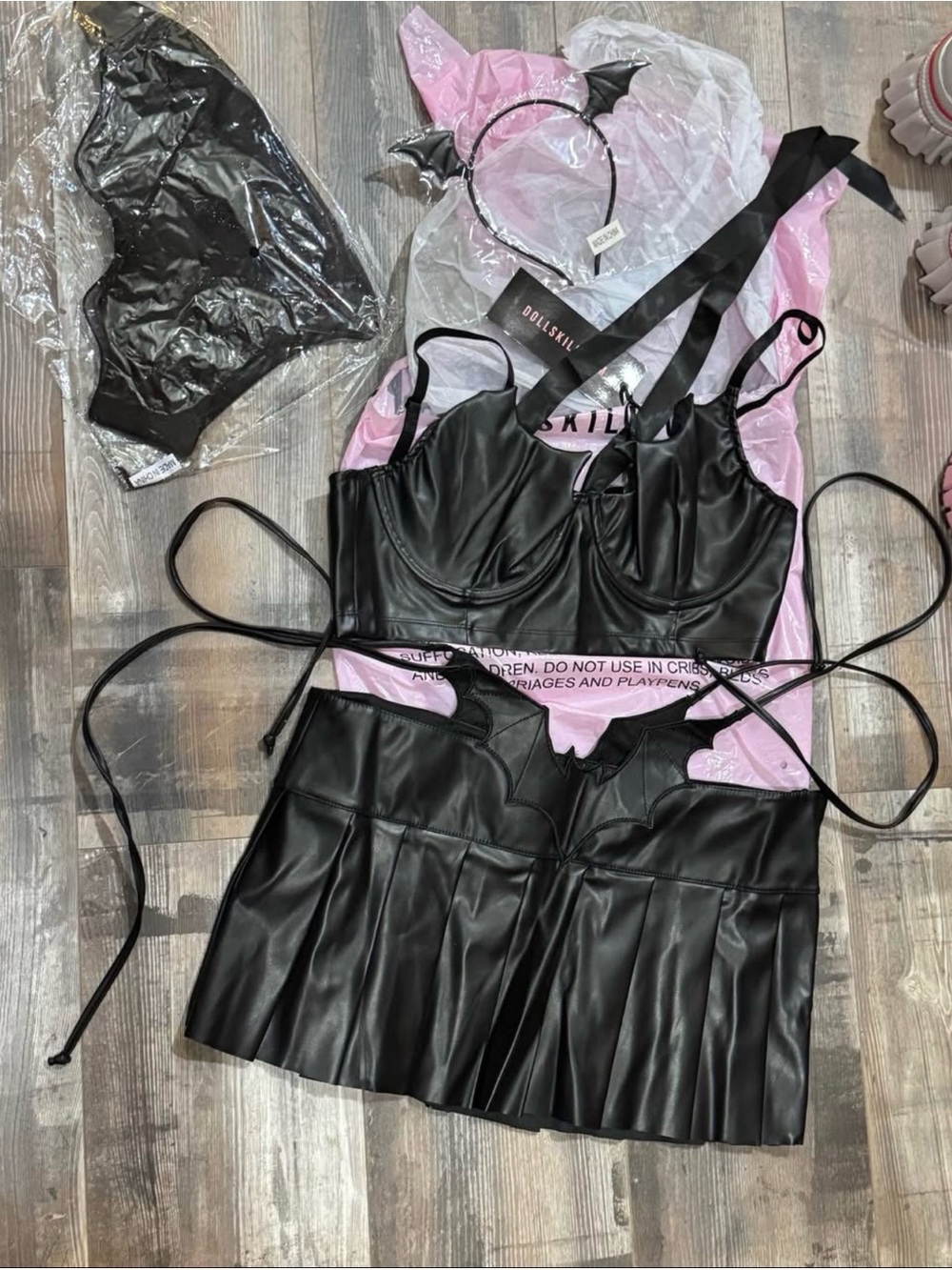 Dolls Kill Black Faux Leather Bustier and Pleated Mini Skirt Set with Bat Trim